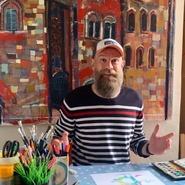 olaf falafel sitting at his desk