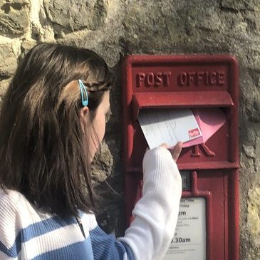girl posting letter