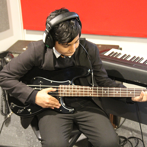 Student Playing Guitar